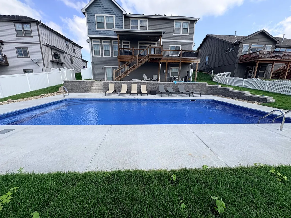 Clear water in a finished Omaha pool built by Olympic Pool & Spa