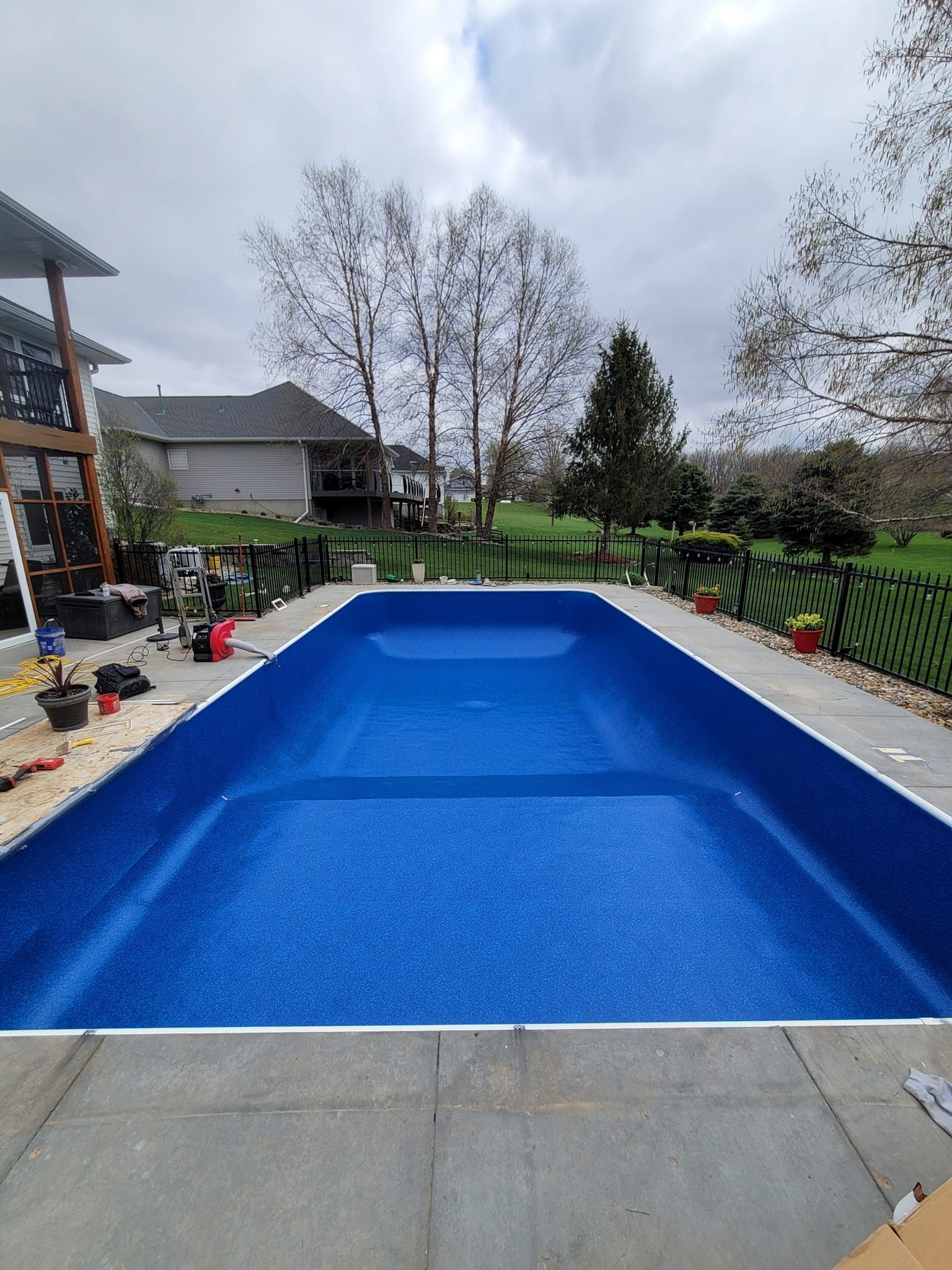 Olympic technician replacing a pool liner