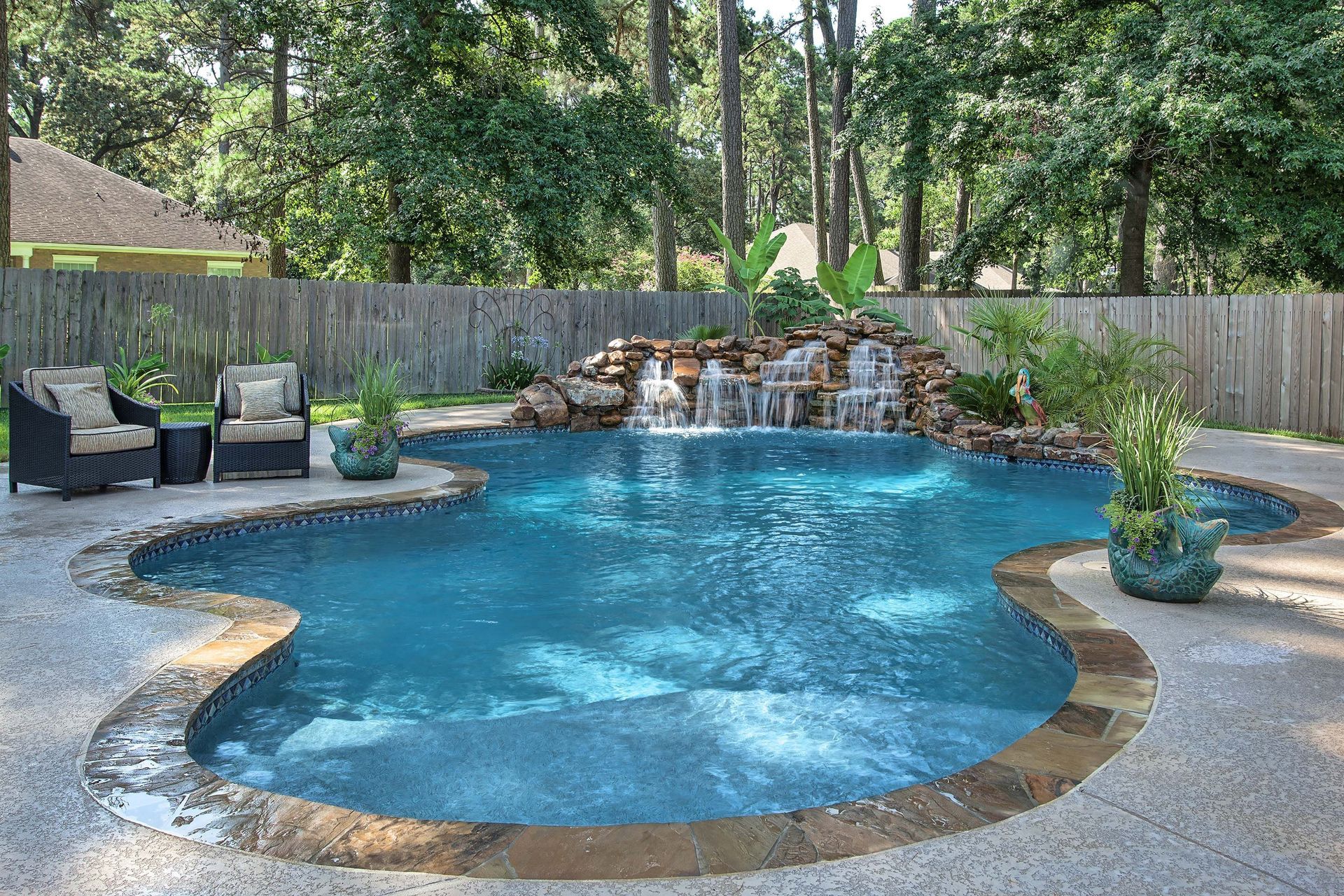 Custom freeform inground pool built by Olympic Pool & Spa